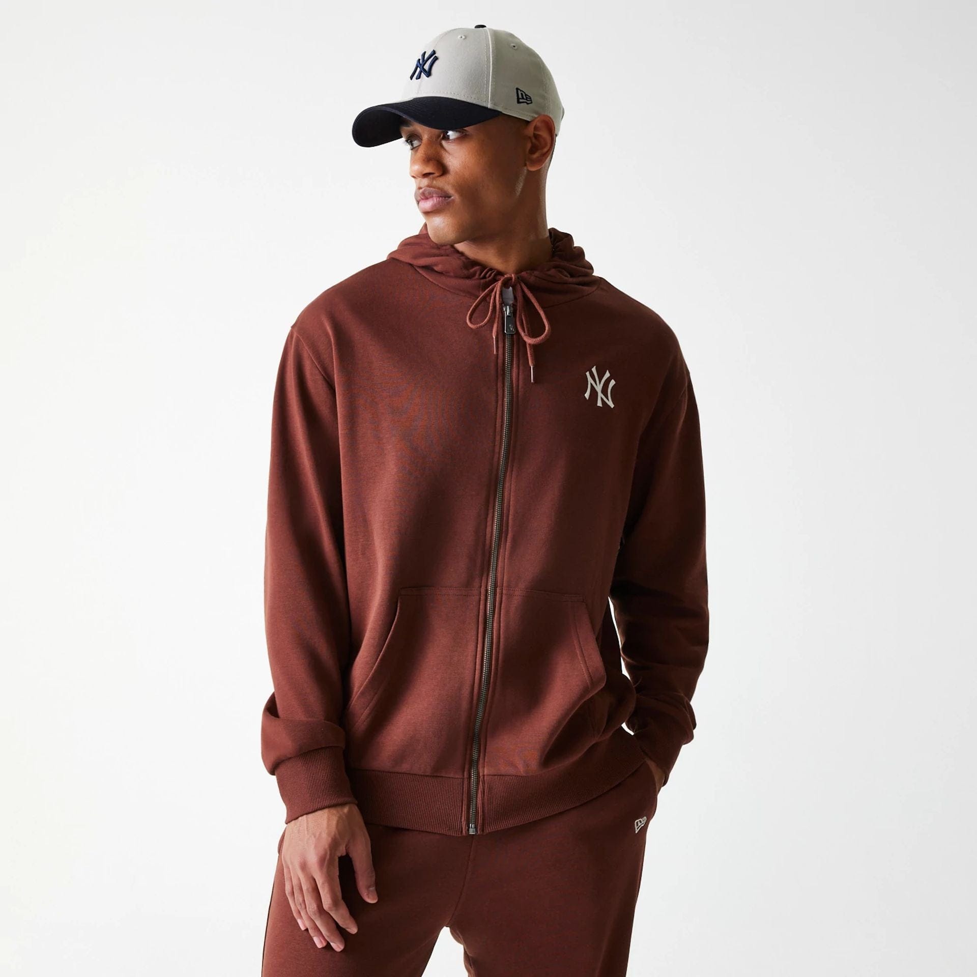 The Male model is wearing New York Yankees MLB Midi League Essential Brown Oversized Full Zip Hoodie 2