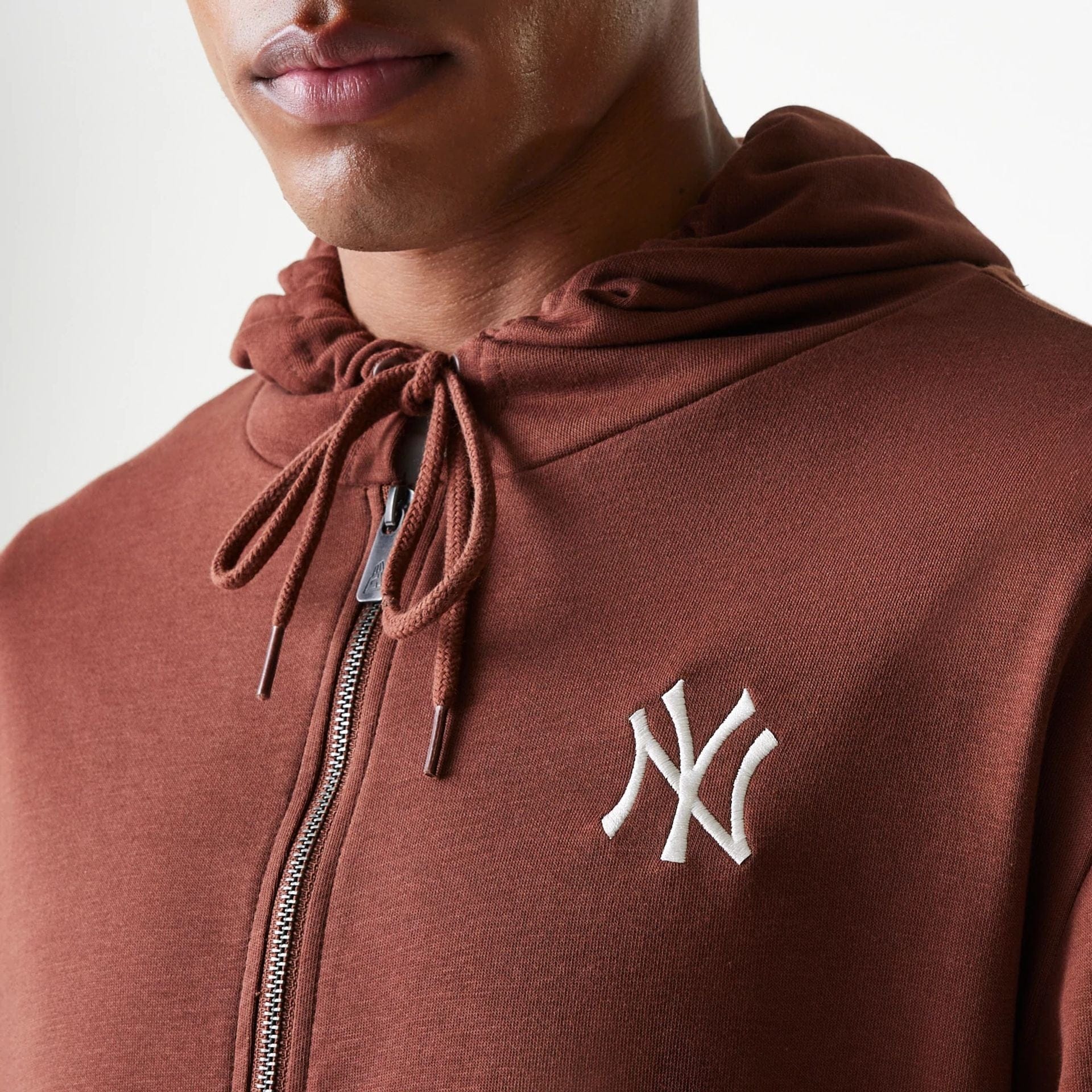 The Male model is wearing New York Yankees MLB Midi League Essential Brown Oversized Full Zip Hoodie 6