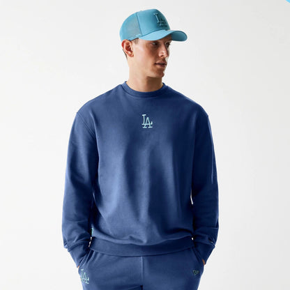 The Male model is wearing LA Dodgers MLB Midi League Essential Dark Blue Oversized Crew Neck Sweater 1
