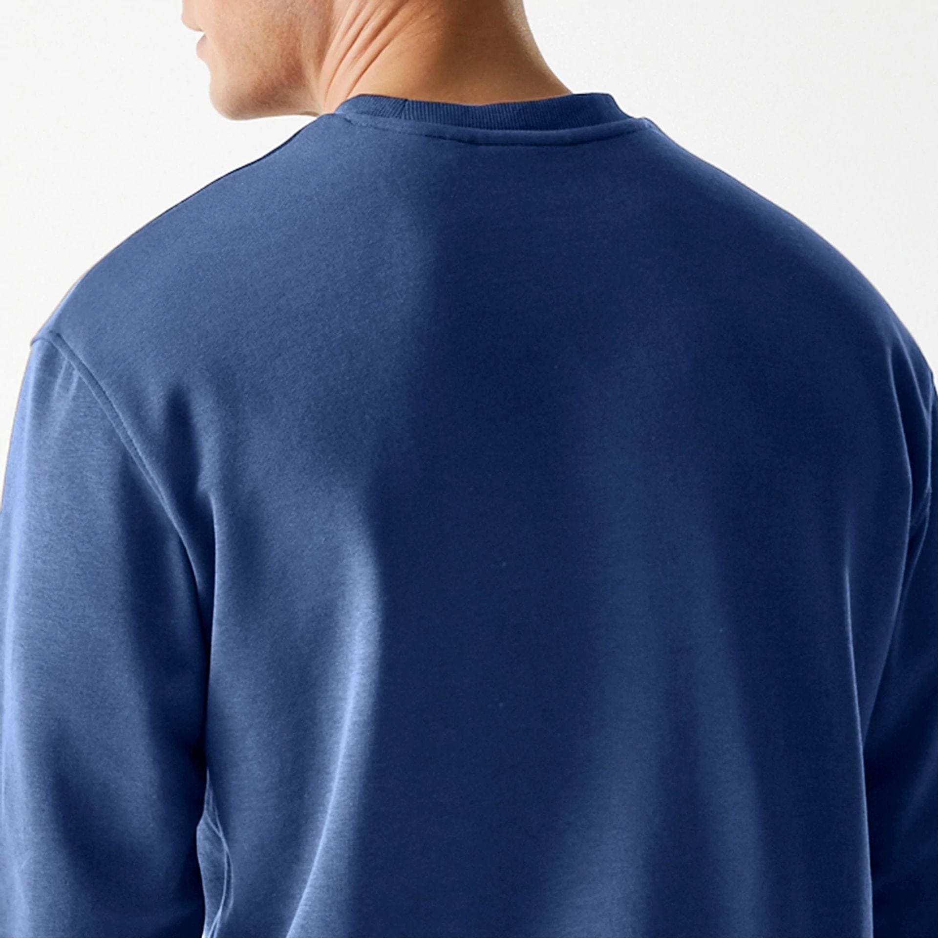 The Male model is wearing LA Dodgers MLB Midi League Essential Dark Blue Oversized Crew Neck Sweater 7