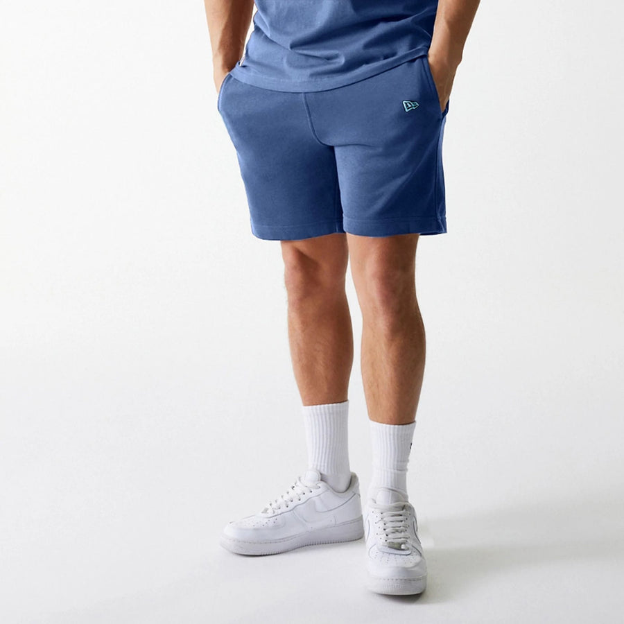 The Male model is wearing LA Dodgers MLB Midi League Essential Dark Blue Shorts 4