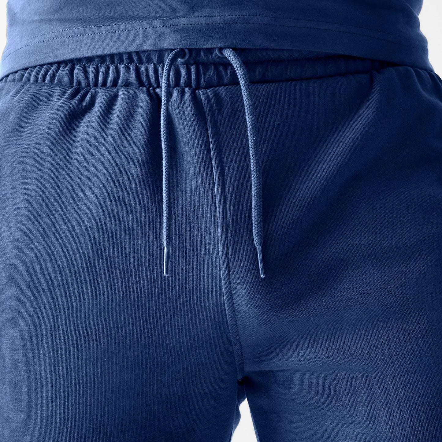 The Male model is wearing LA Dodgers MLB Midi League Essential Dark Blue Shorts 6