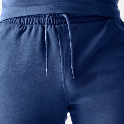 The Male model is wearing LA Dodgers MLB Midi League Essential Dark Blue Shorts 6