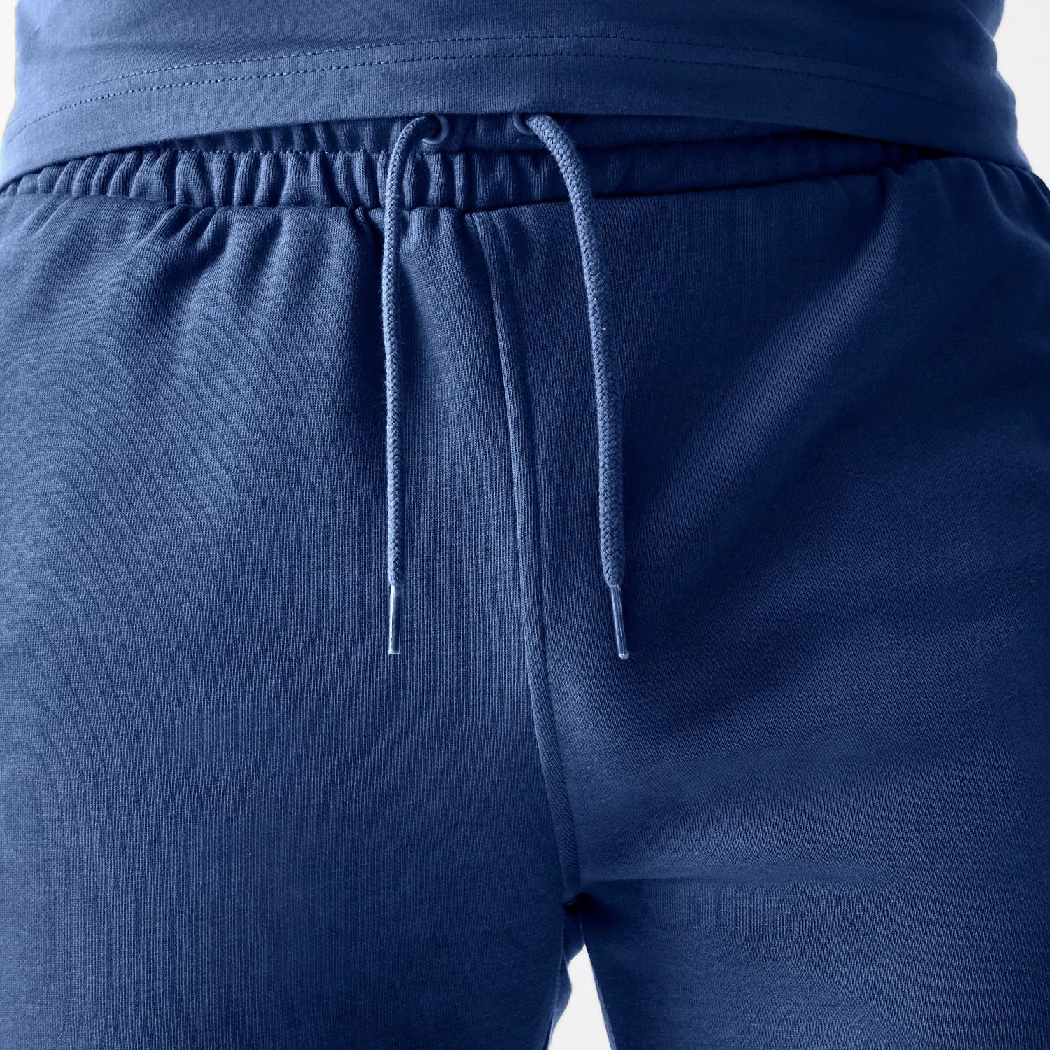 The Male model is wearing LA Dodgers MLB Midi League Essential Dark Blue Shorts 6