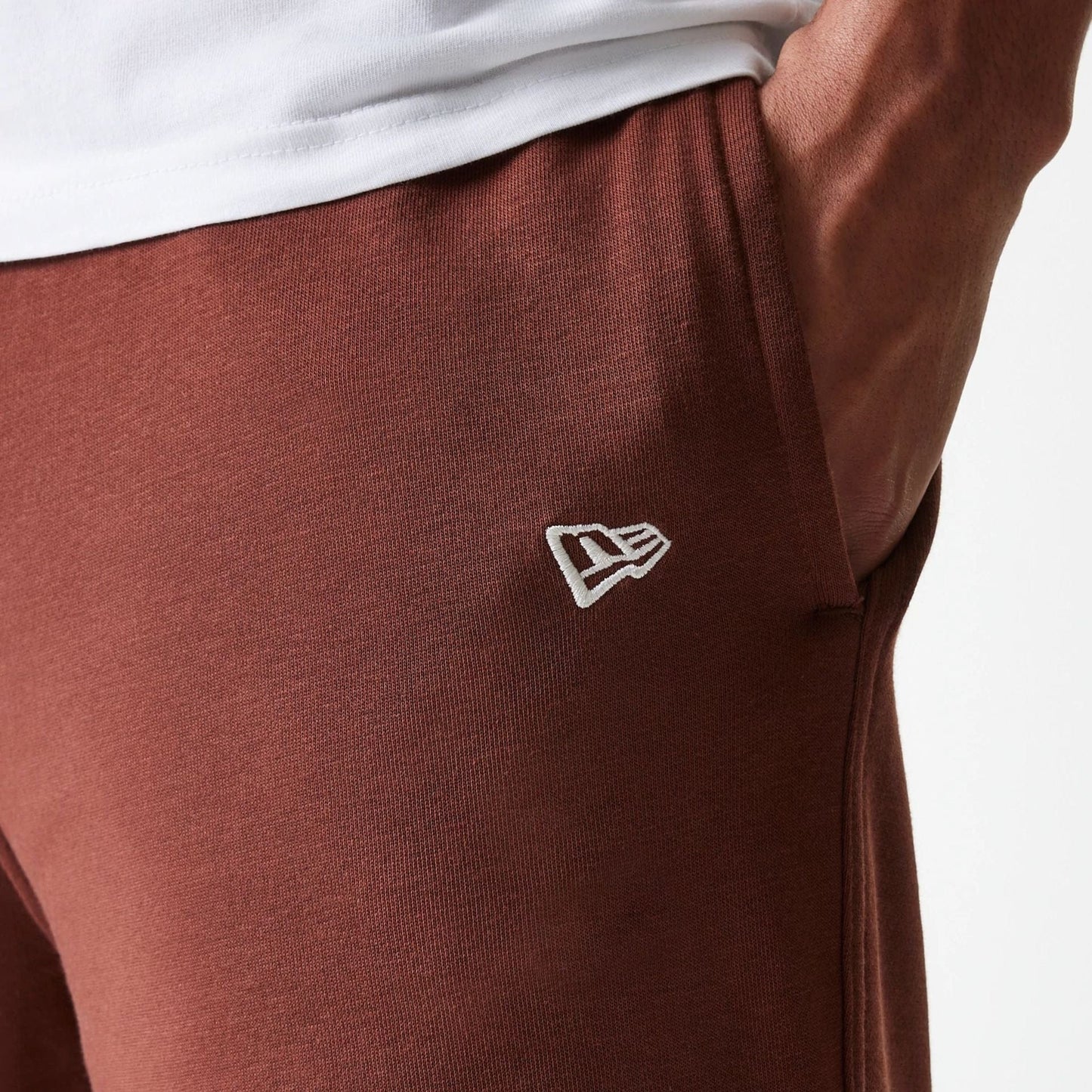 The Male model is wearing New York Yankees MLB Midi League Essential Brown Joggers 5