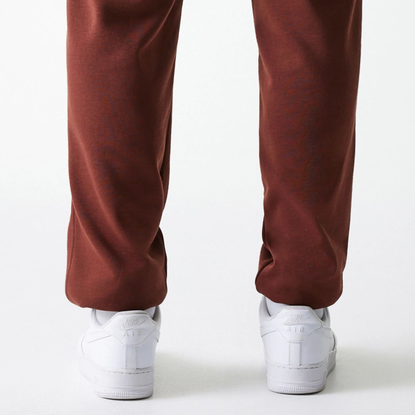 The Male model is wearing New York Yankees MLB Midi League Essential Brown Joggers 7