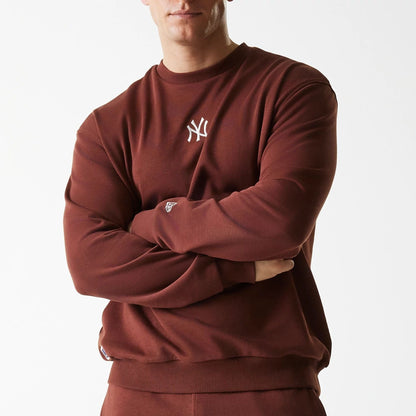 The Male model is wearing New York Yankees MLB Midi League Essential Brown Oversized Crew Neck Sweater 3