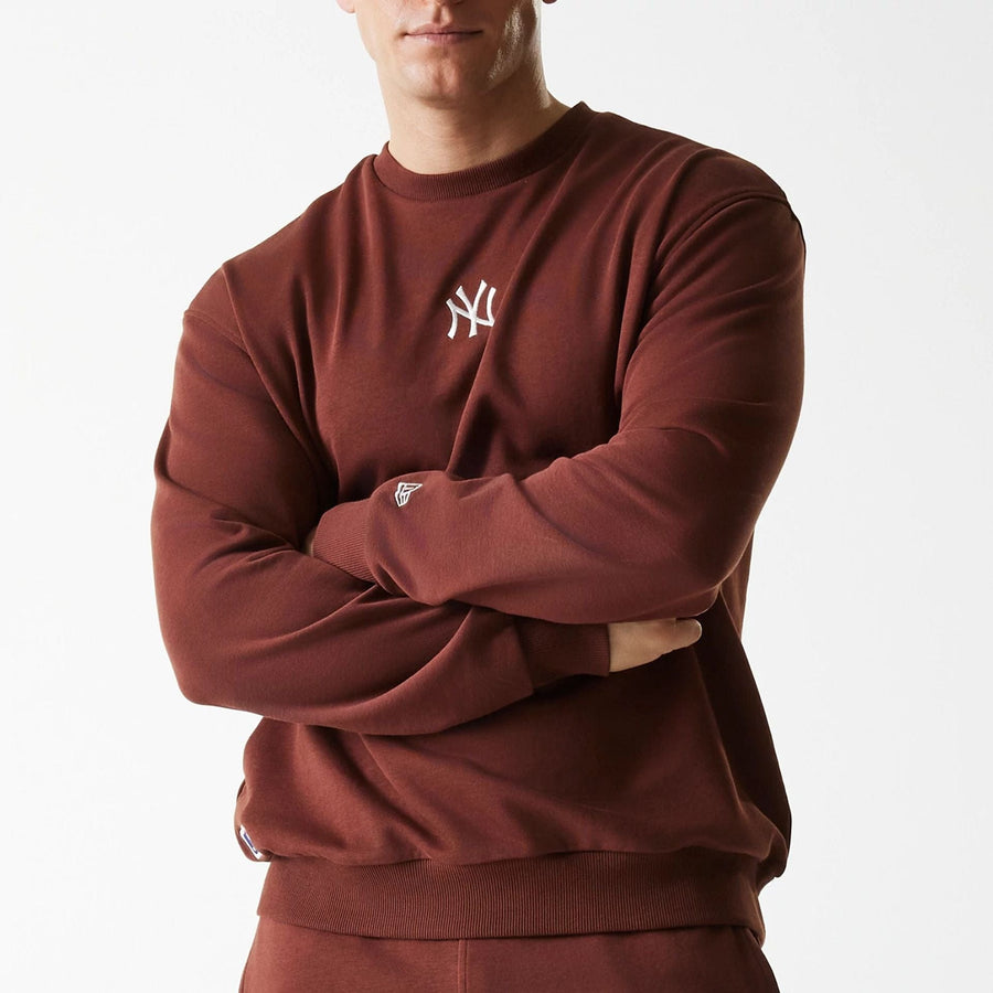 The Male model is wearing New York Yankees MLB Midi League Essential Brown Oversized Crew Neck Sweater 3