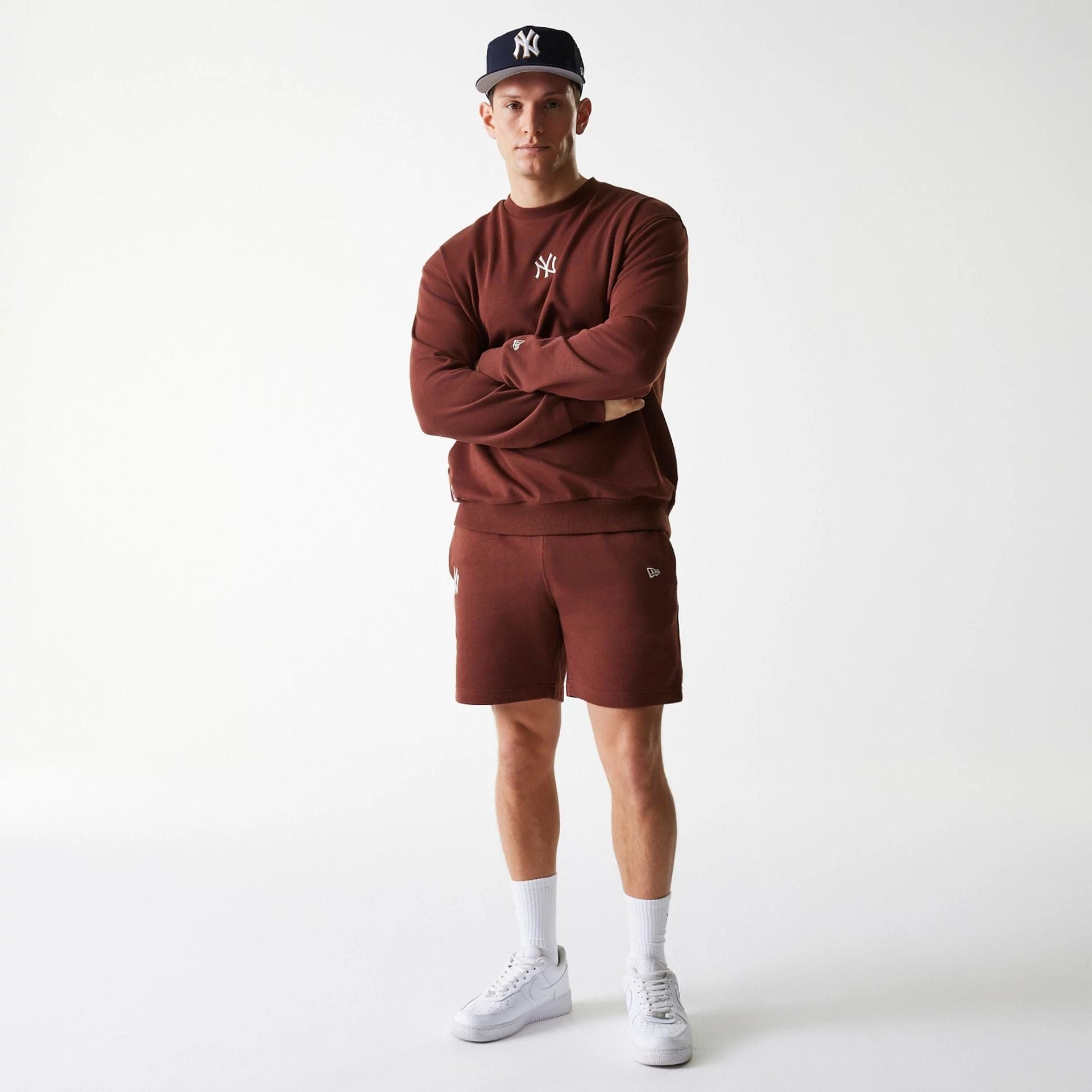 The Male model is wearing New York Yankees MLB Midi League Essential Brown Oversized Crew Neck Sweater 8