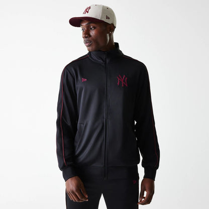 The Male model is wearing New York Yankees MLB Black Track Top 1