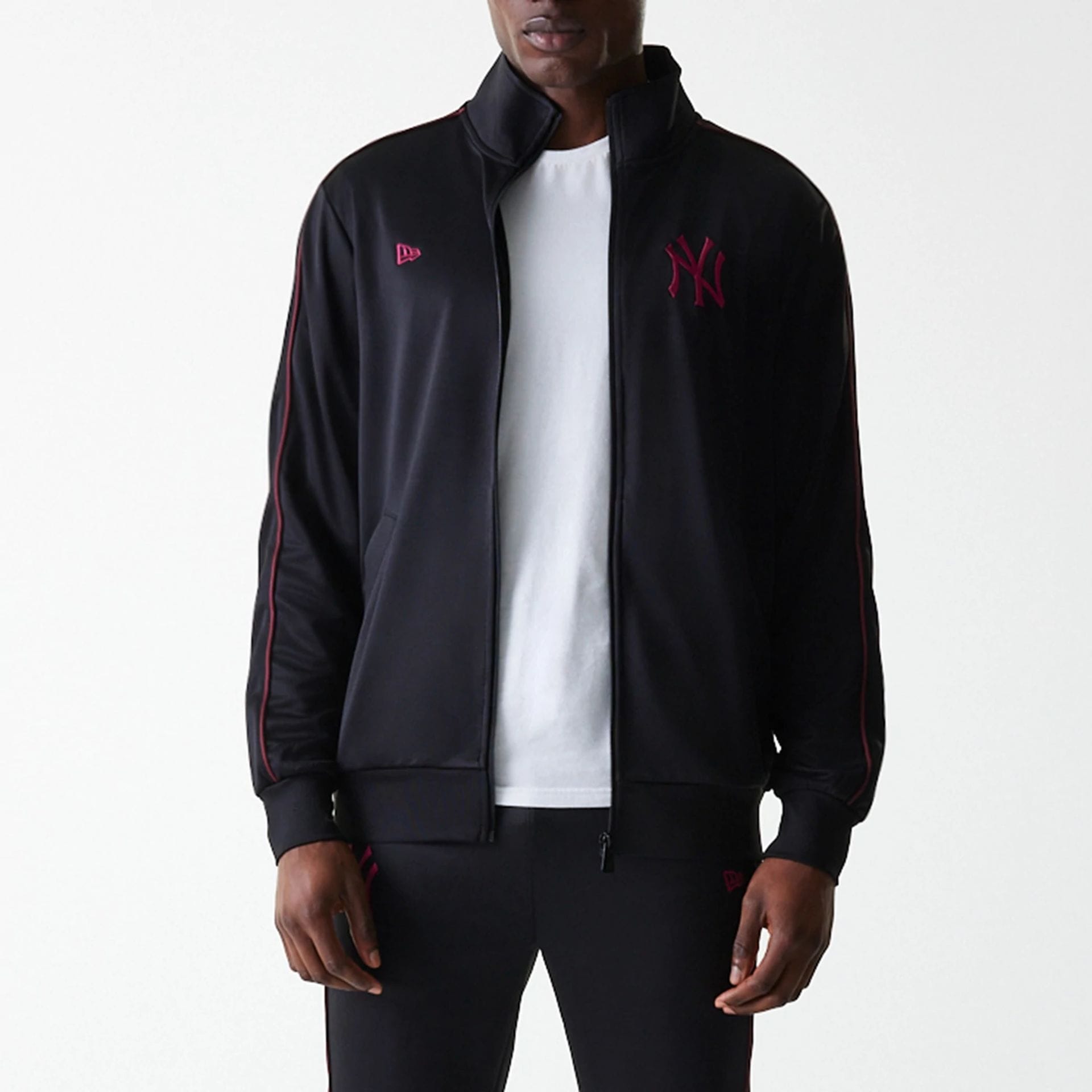 The Male model is wearing New York Yankees MLB Black Track Top 3