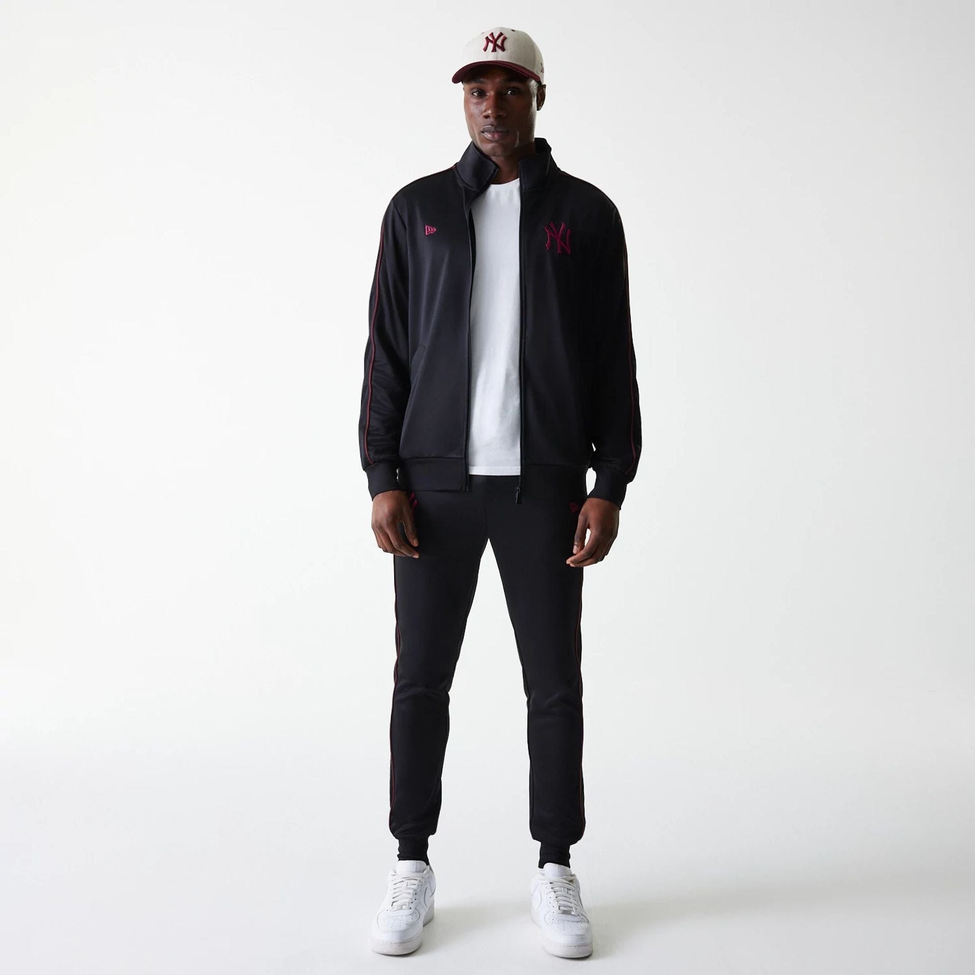 The Male model is wearing New York Yankees MLB Black Track Top 8