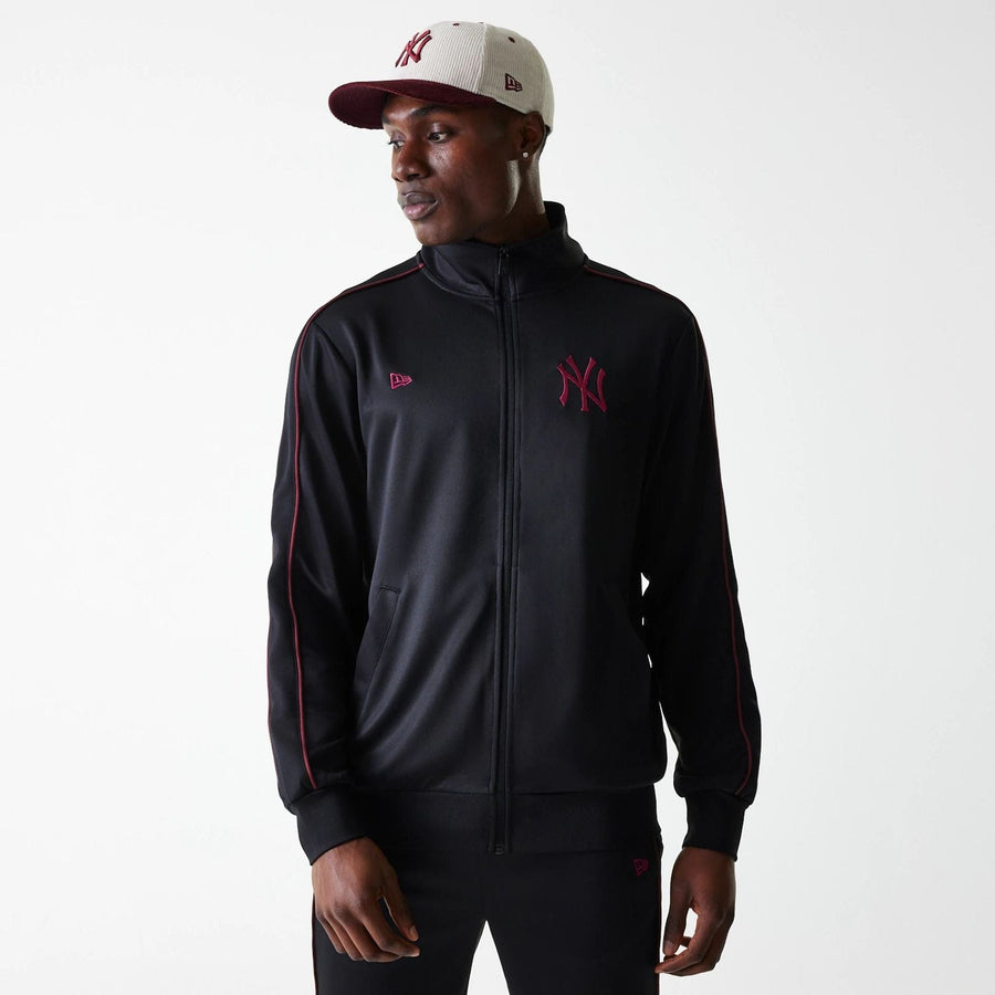 The Male model is wearing New York Yankees MLB Black Track Top 1