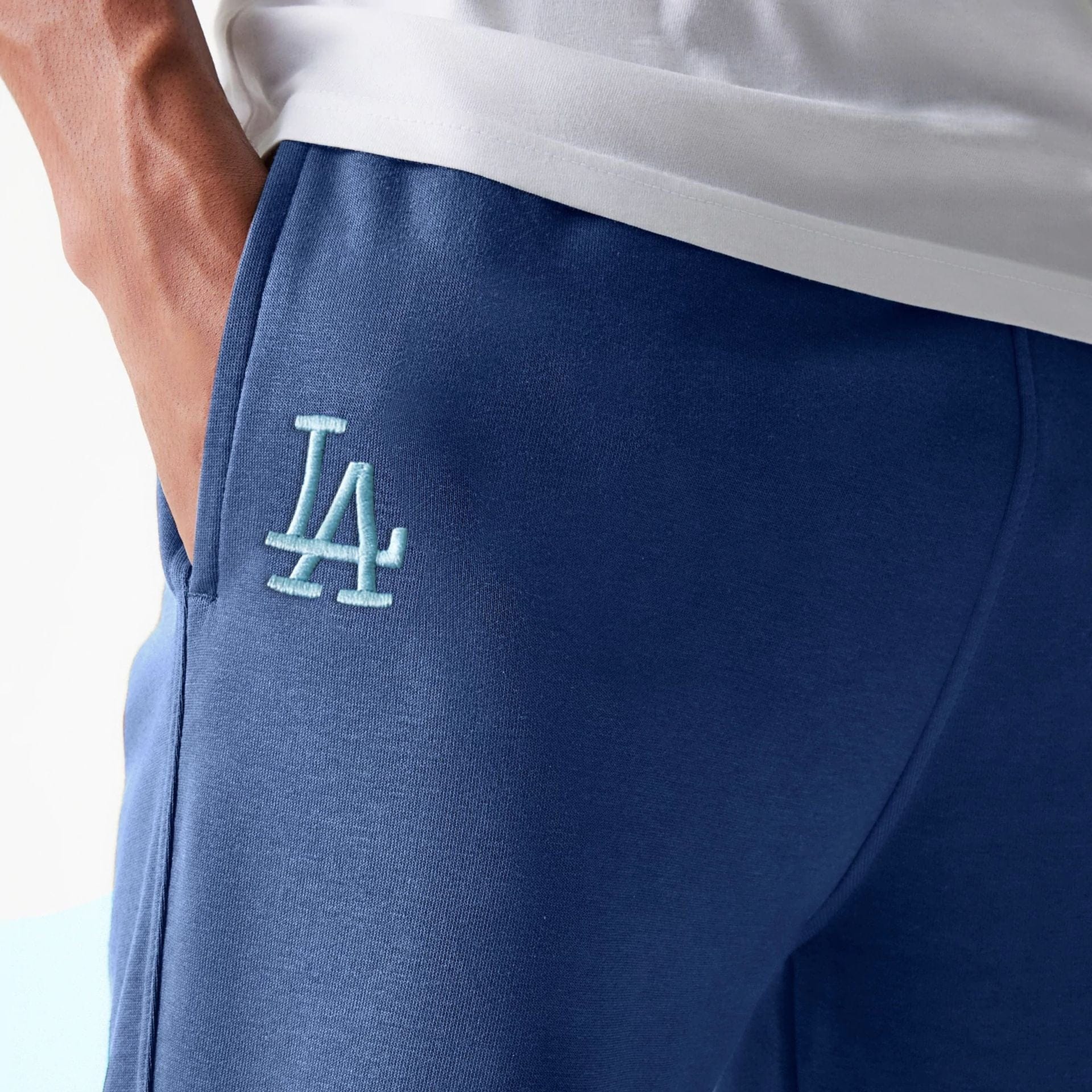 The Male model is wearing LA Dodgers MLB Midi League Essential Blue Joggers 3