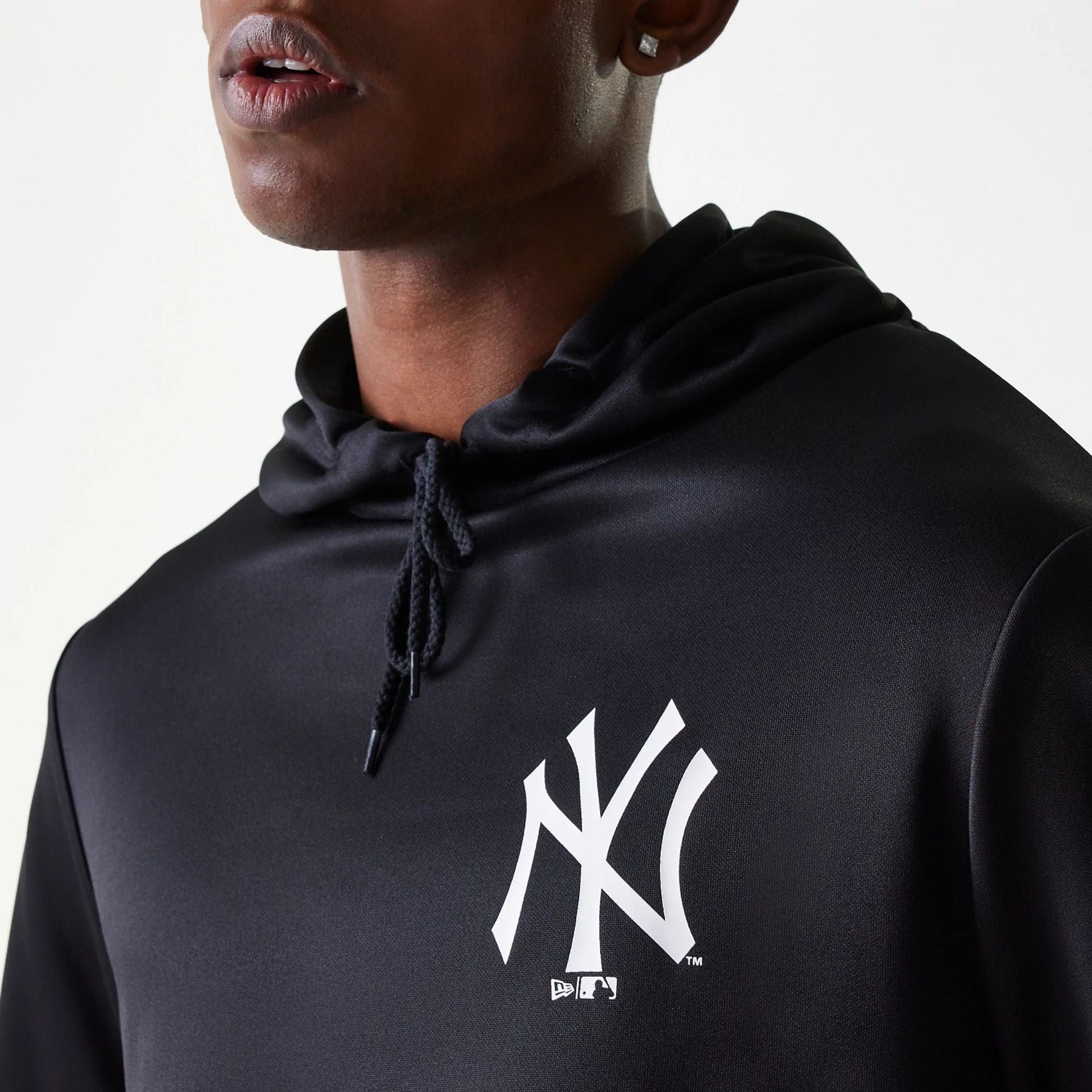 The Male model is wearing New York Yankees MLB Essentials Black Pullover Hoodie 4