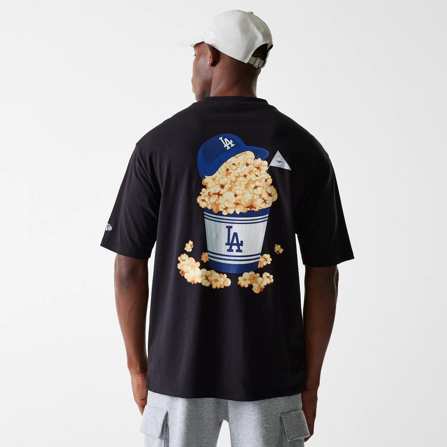 The Male model is wearing LA Dodgers MLB Food Graphic Black Oversized T-Shirt 2