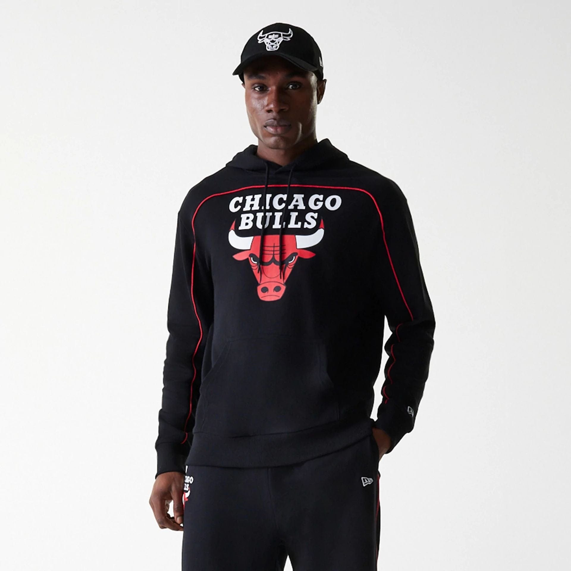 The Male model is wearing Chicago Bulls NBA Piping Black Oversized Pullover Hoodie 7