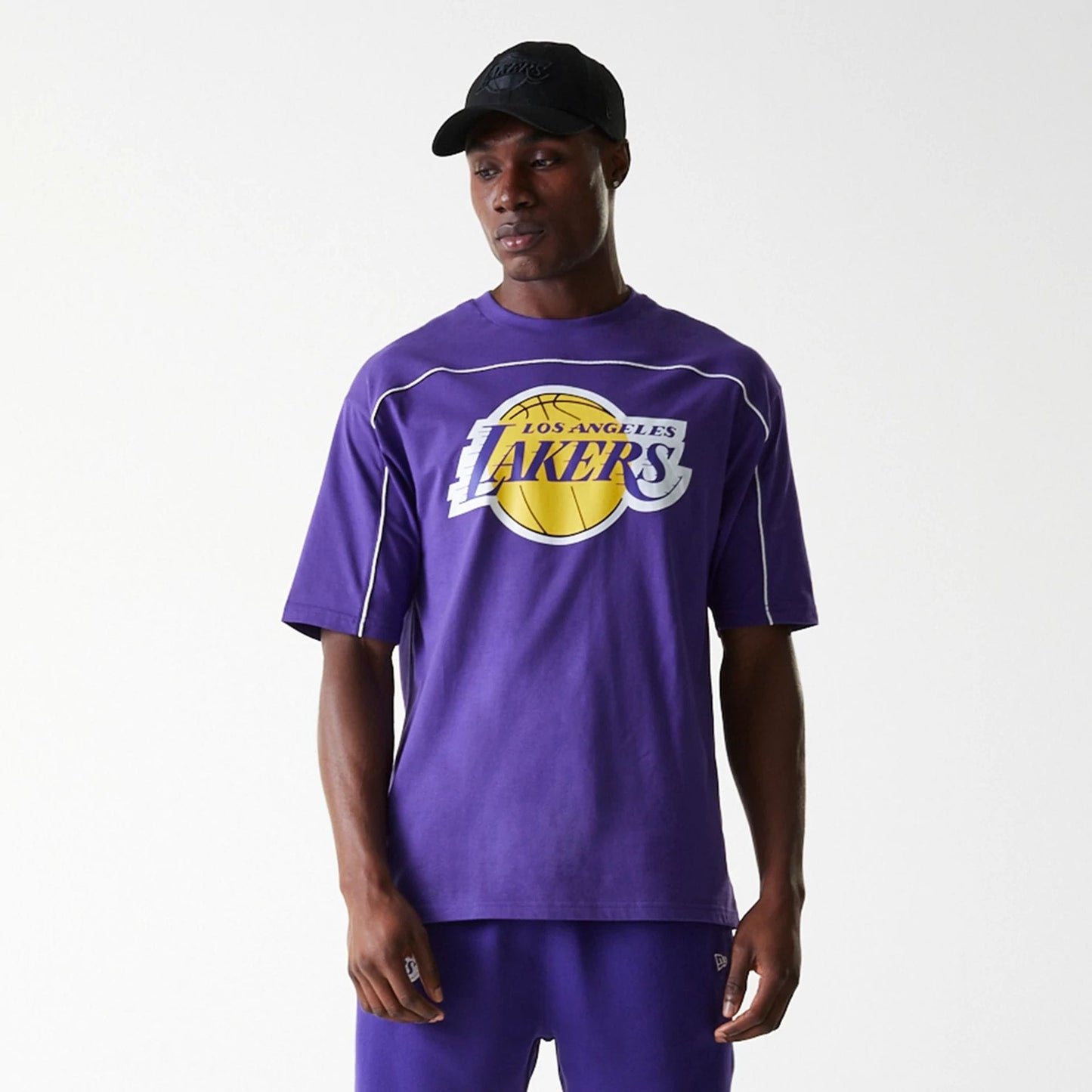 The Male model is wearing LA Lakers NBA Piping Purple Oversized T-Shirt 7