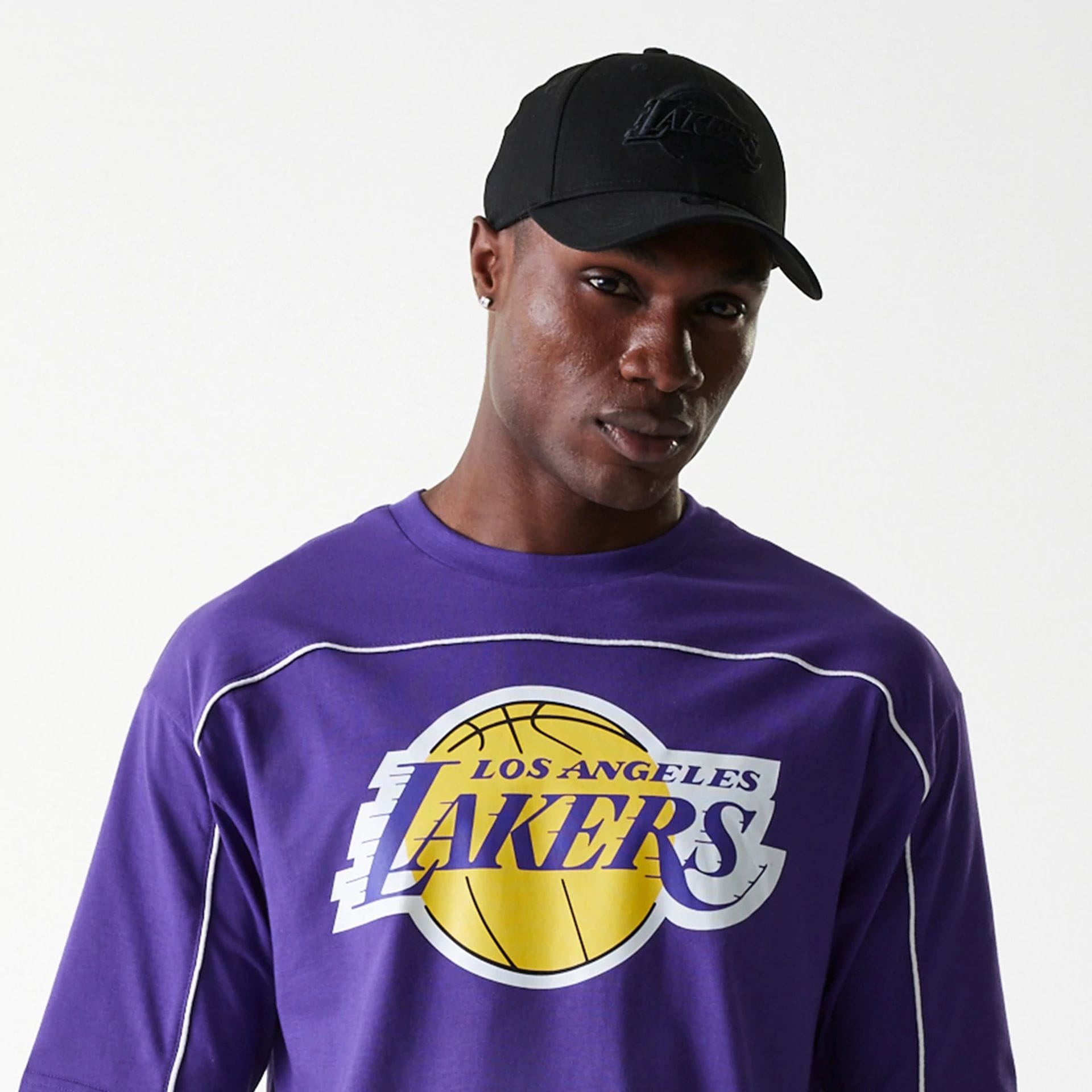 The Male model is wearing LA Lakers NBA Piping Purple Oversized T-Shirt 5