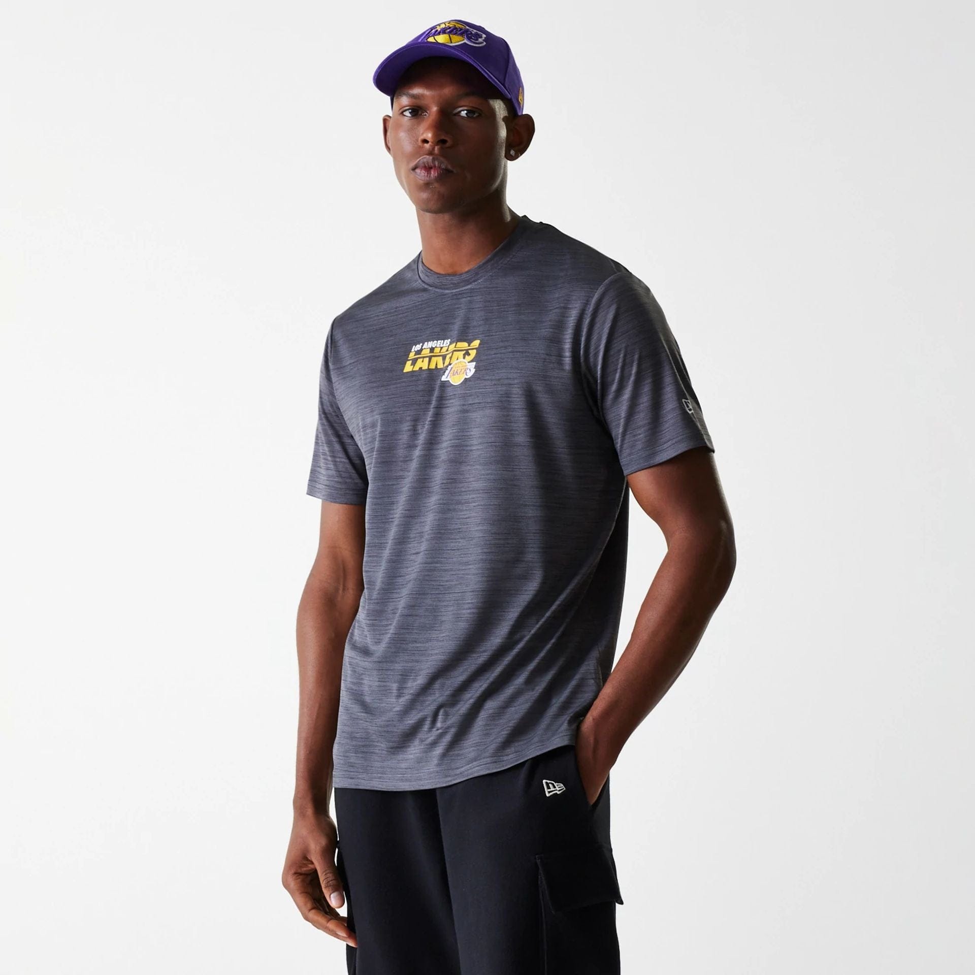 The Male model is wearing LA Lakers NBA Essentials Black T-Shirt 1