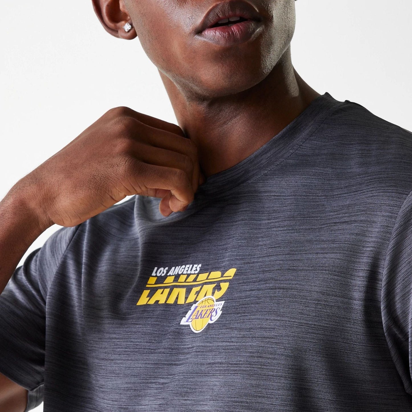 The Male model is wearing LA Lakers NBA Essentials Black T-Shirt 4