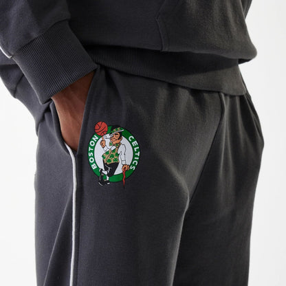 The Male model is wearing Boston Celtics NBA Piping Dark Grey Joggers 3