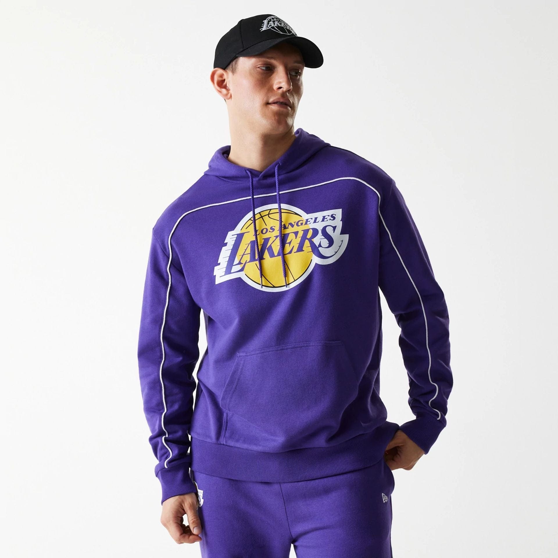 The Male model is wearing LA Lakers NBA Piping Purple Oversized Pullover Hoodie 1