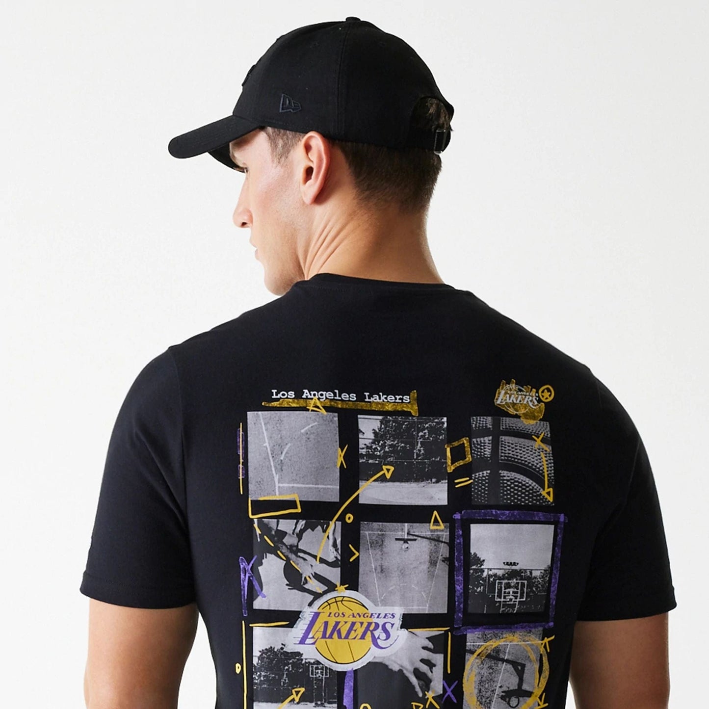 The Male model is wearing LA Lakers NBA Photographic Print Black T-Shirt 4