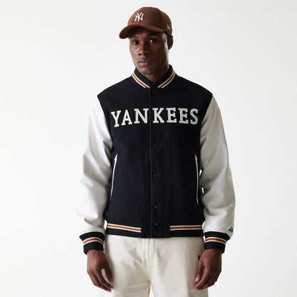 The Male model is wearing New York Yankees MLB Wordmark Black Varsity Jacket 1