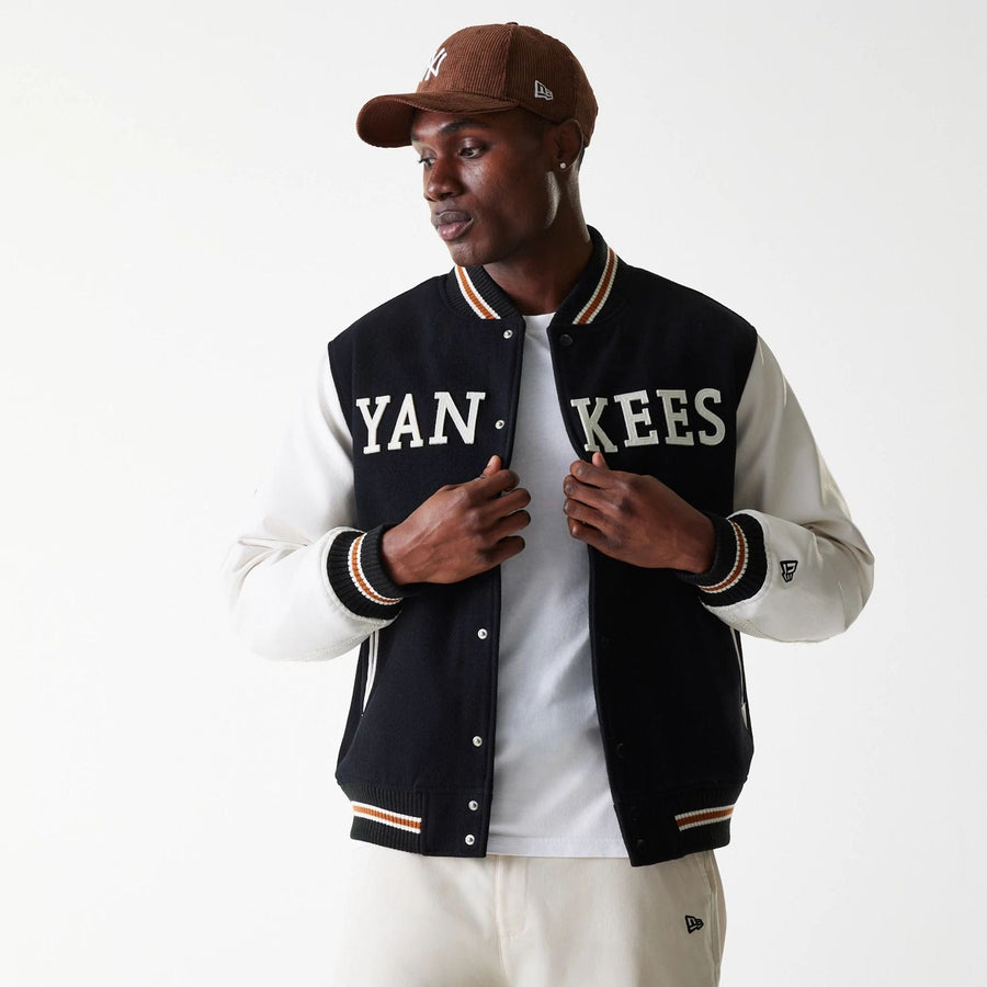 The Male model is wearing New York Yankees MLB Wordmark Black Varsity Jacket 3