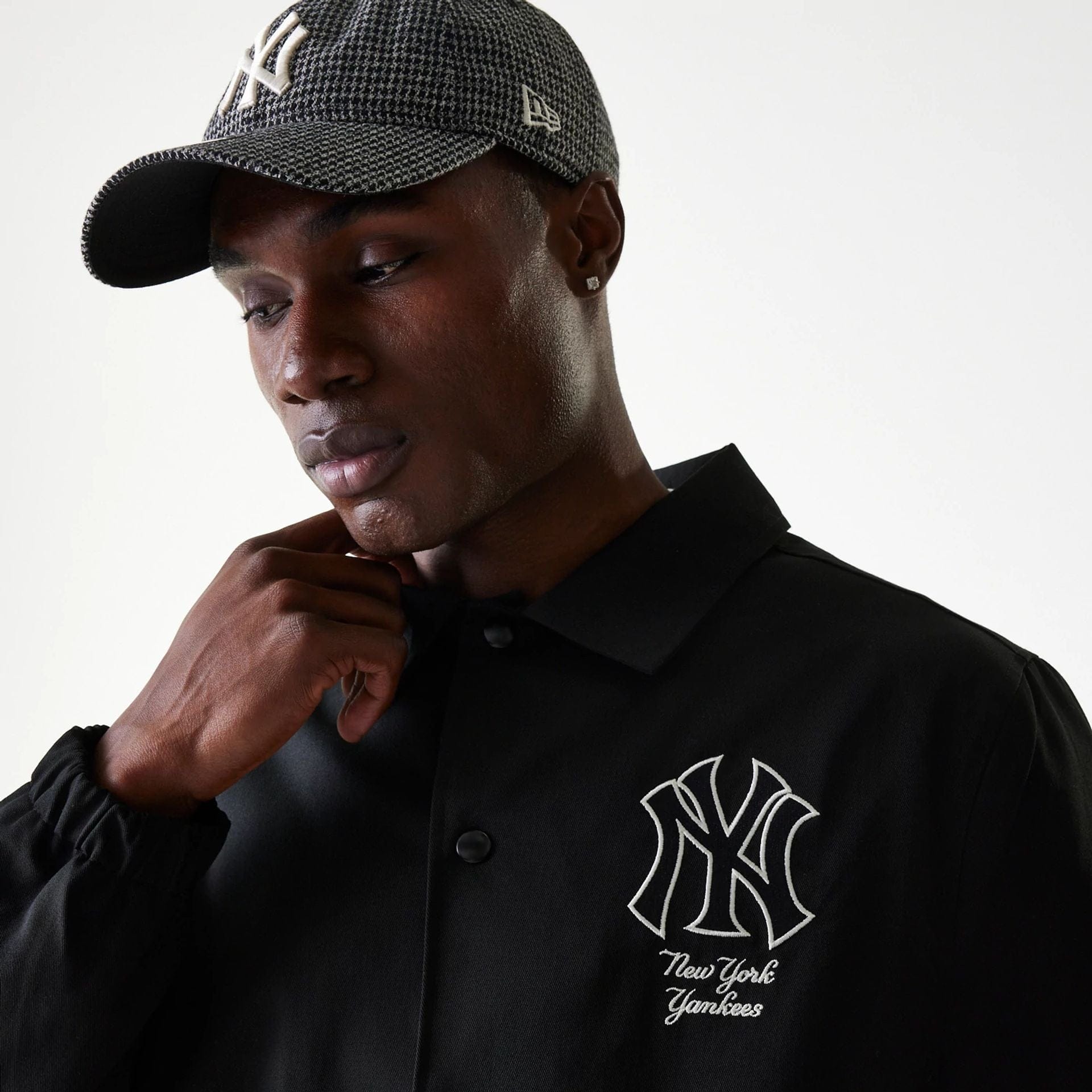 The Male model is wearing New York Yankees MLB Twill Black Coaches Jacket 4