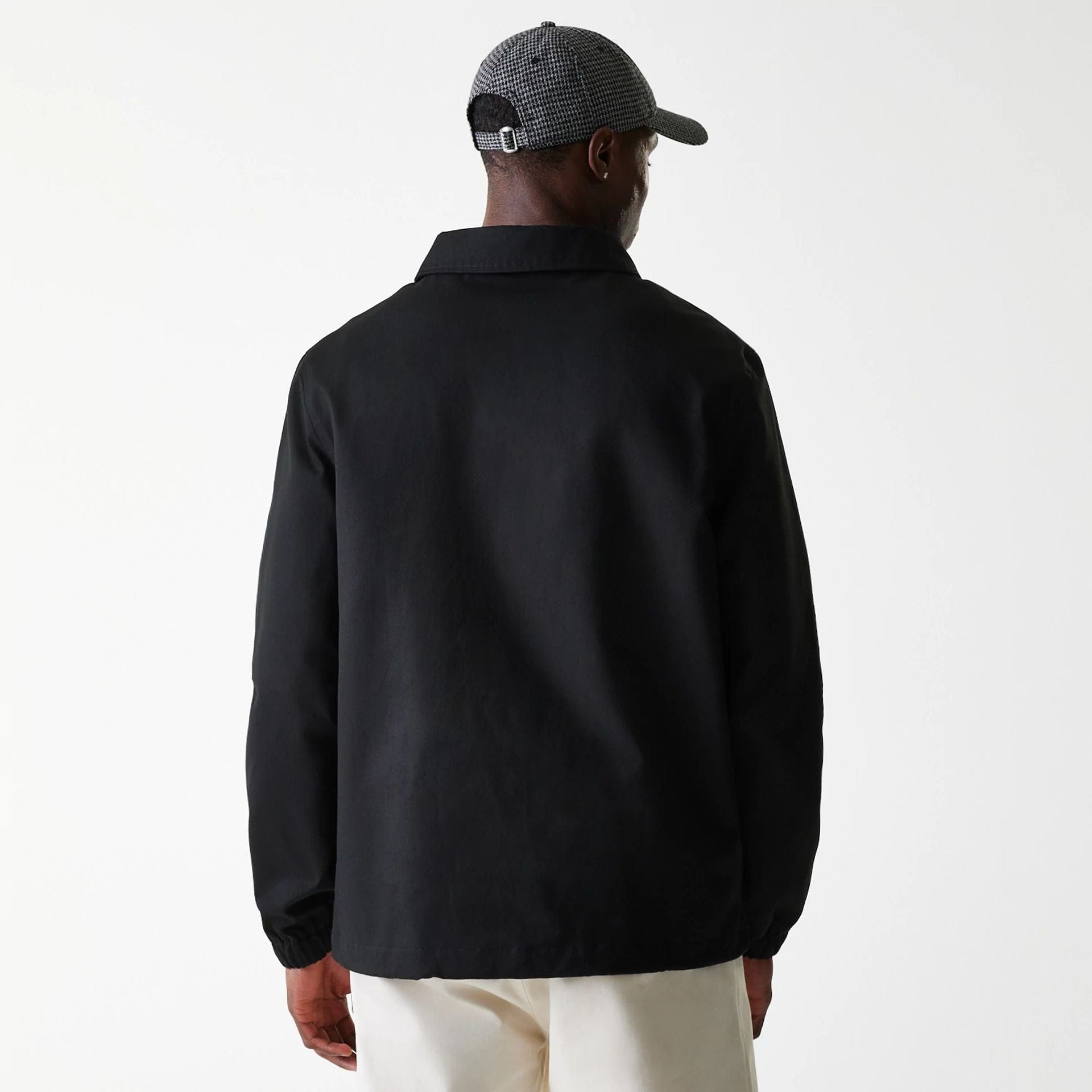The Male model is wearing New York Yankees MLB Twill Black Coaches Jacket 2