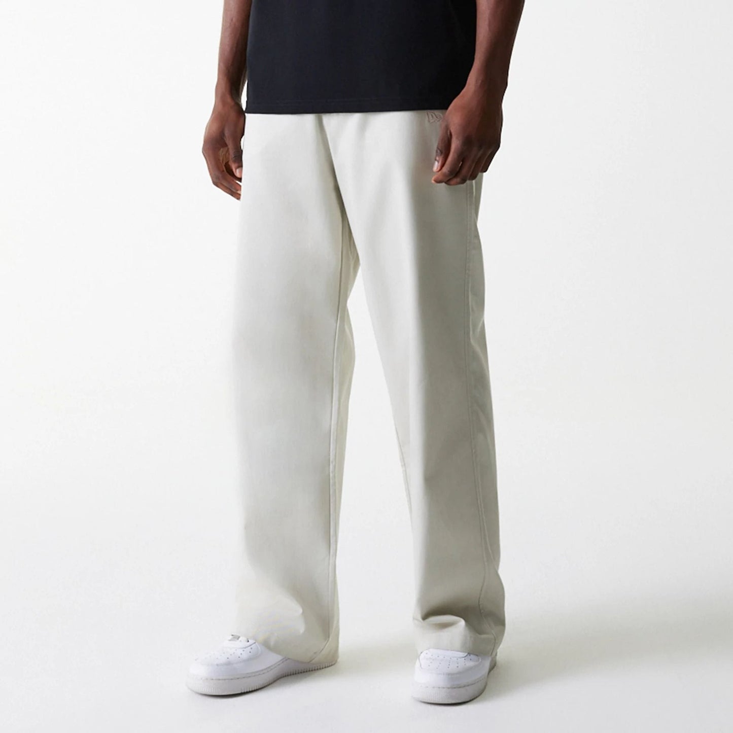 The Male model is wearing New York Yankees MLB Light Beige Chino Trousers 3