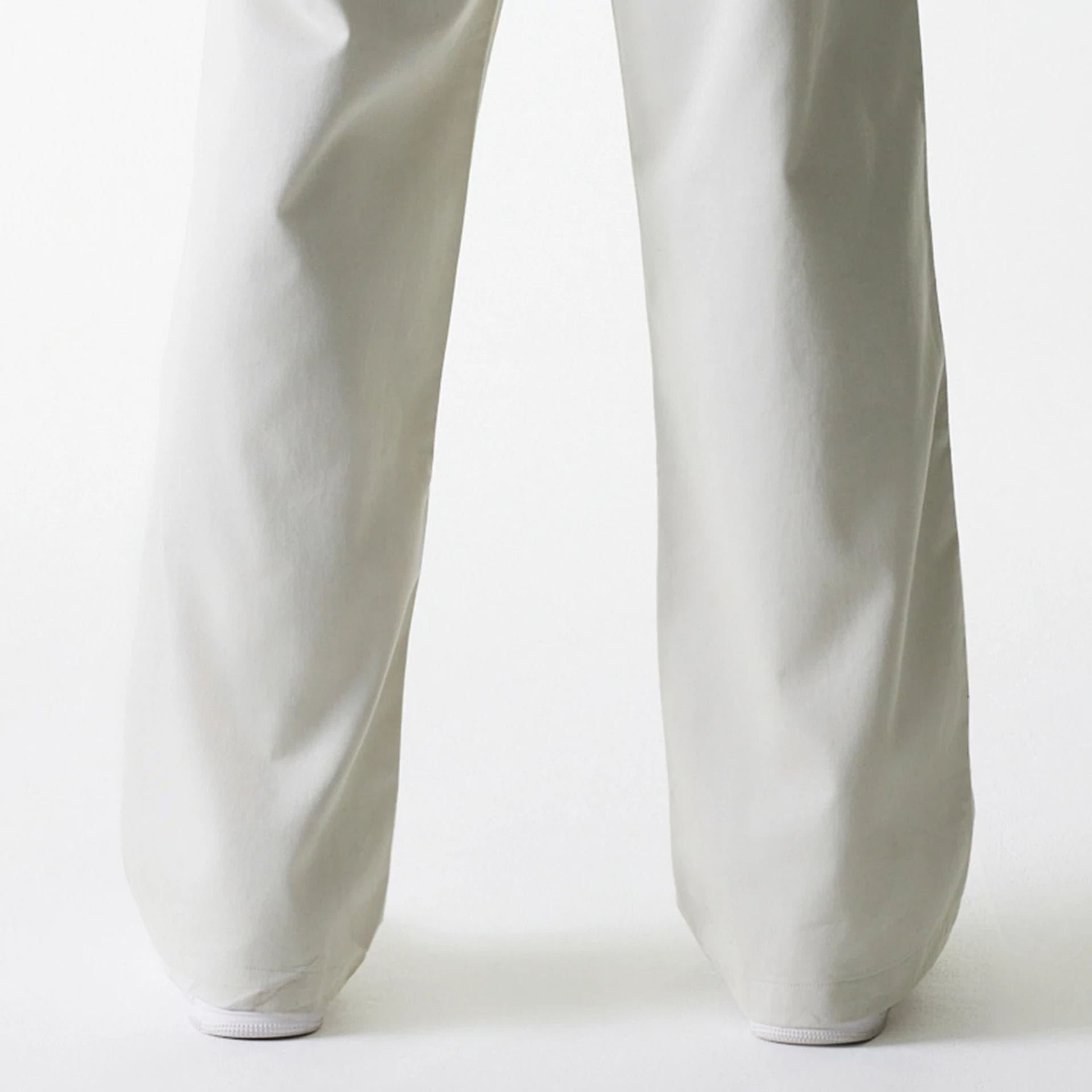 The Male model is wearing New York Yankees MLB Light Beige Chino Trousers 7
