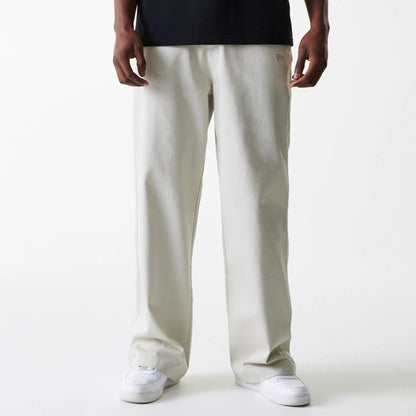 The Male model is wearing New York Yankees MLB Light Beige Chino Trousers 1