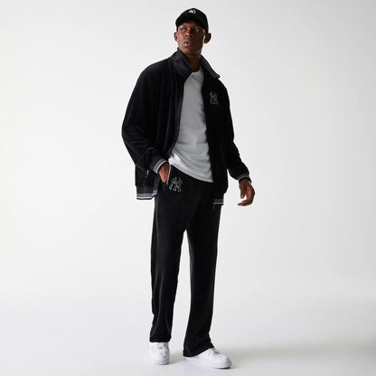 The Male model is wearing New York Yankees MLB Velour Black Track Pants 3
