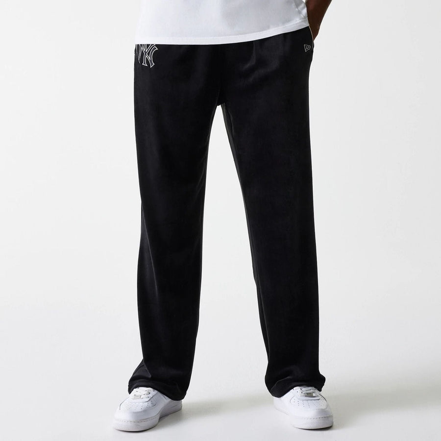 The Male model is wearing New York Yankees MLB Velour Black Track Pants 5