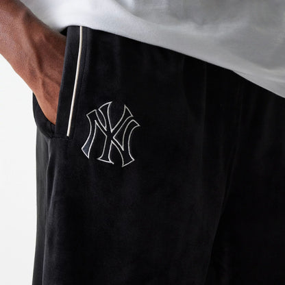 The Male model is wearing New York Yankees MLB Velour Black Track Pants 6