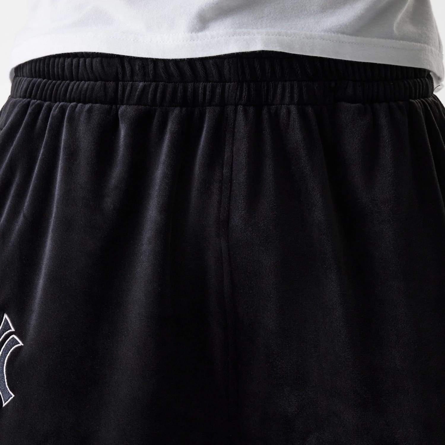 The Male model is wearing New York Yankees MLB Velour Black Track Pants 8