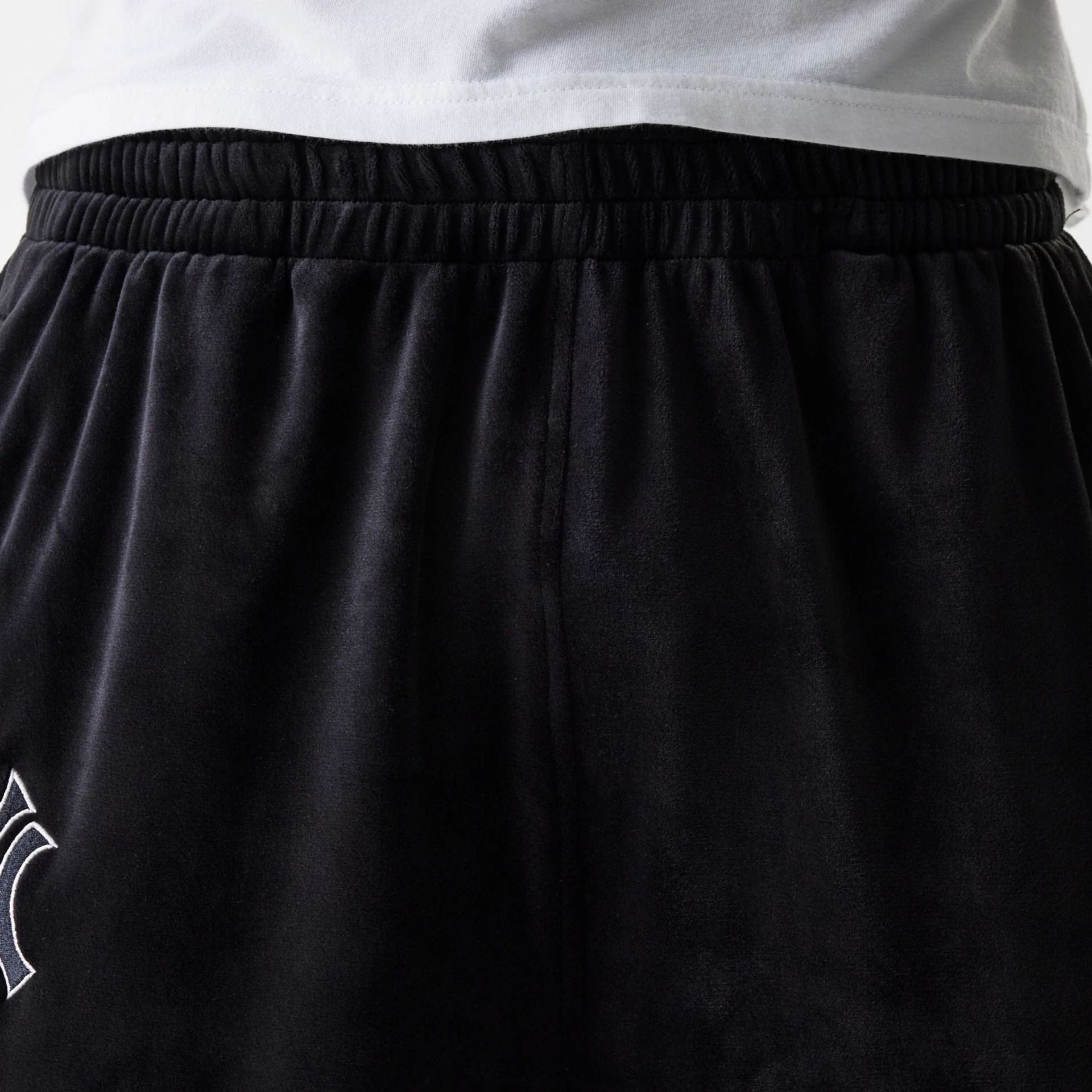 The Male model is wearing New York Yankees MLB Velour Black Track Pants 8