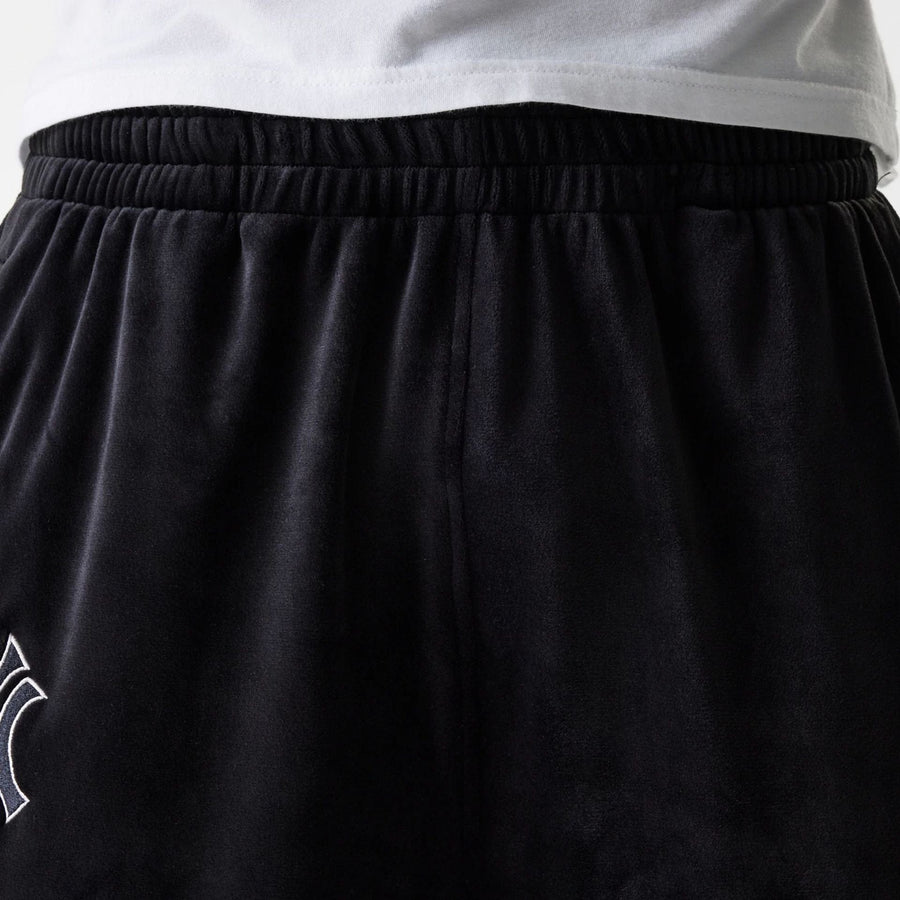 The Male model is wearing New York Yankees MLB Velour Black Track Pants 8