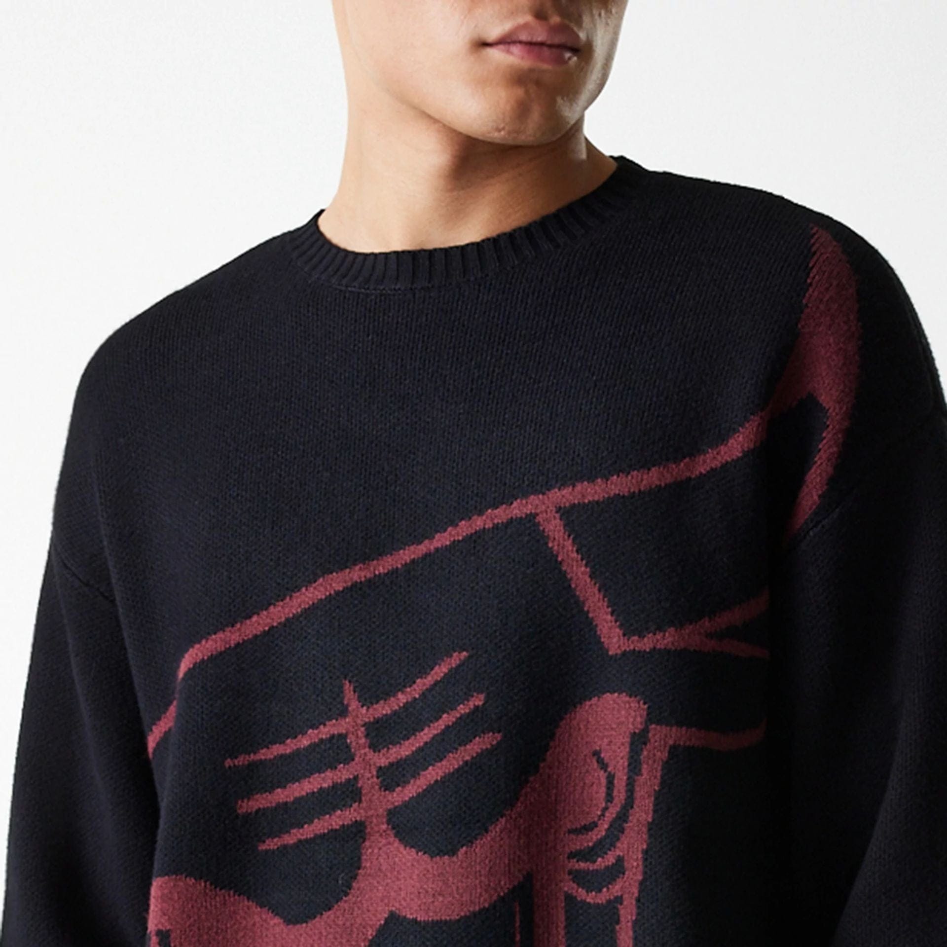 The Male model is wearing Chicago Bulls NBA Knit Black Oversized Knit Sweater 5