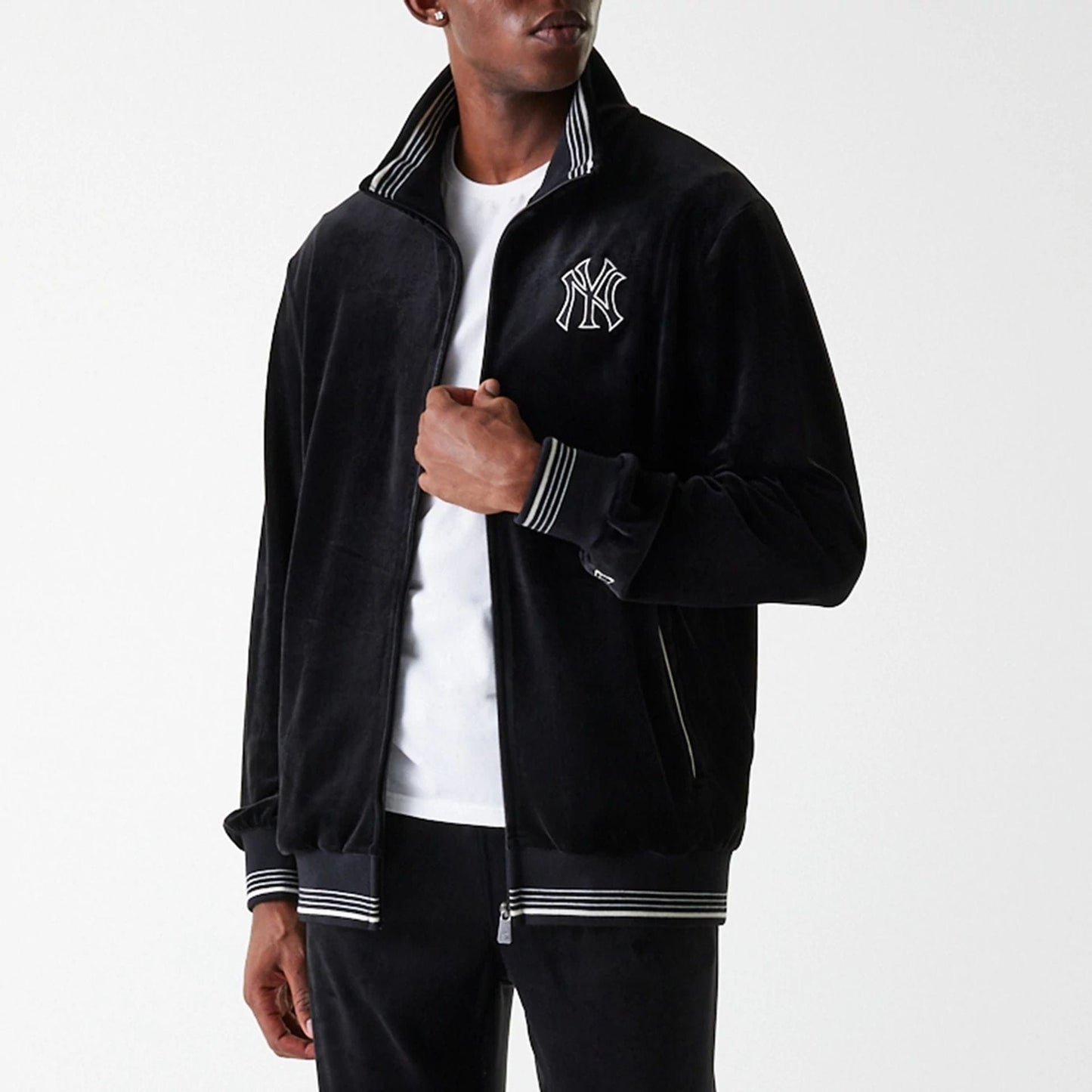 The Male model is wearing New York Yankees MLB Velour Black Track Top 5