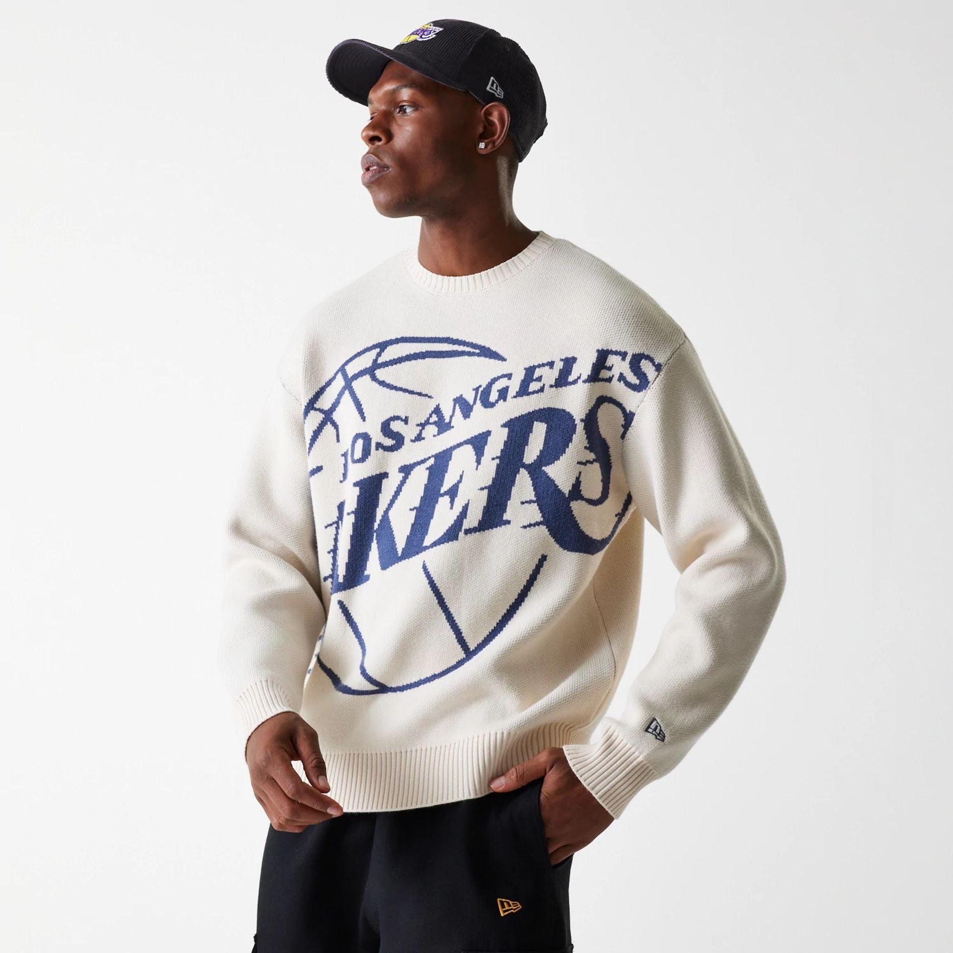 The Male model is wearing LA Lakers NBA Knit Light Beige Oversized Knit Sweater 2
