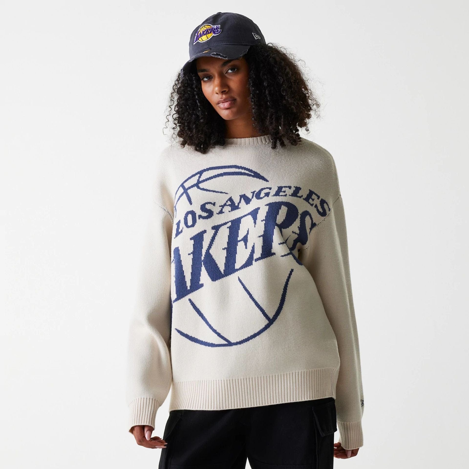 The Male model is wearing LA Lakers NBA Knit Light Beige Oversized Knit Sweater 4