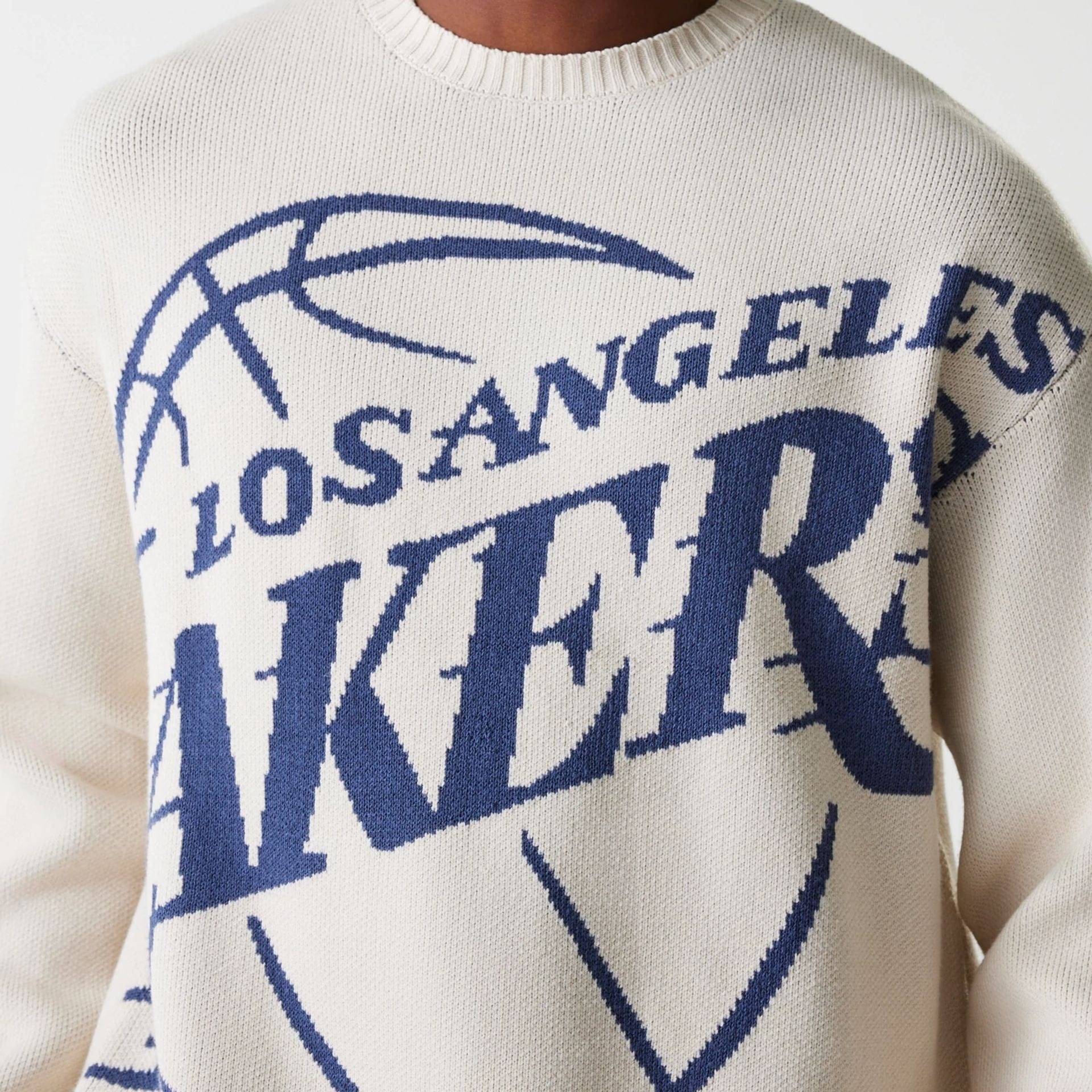 The Male model is wearing LA Lakers NBA Knit Light Beige Oversized Knit Sweater 5