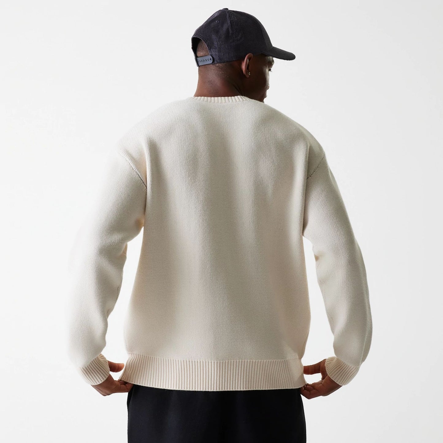 The Male model is wearing LA Lakers NBA Knit Light Beige Oversized Knit Sweater 3