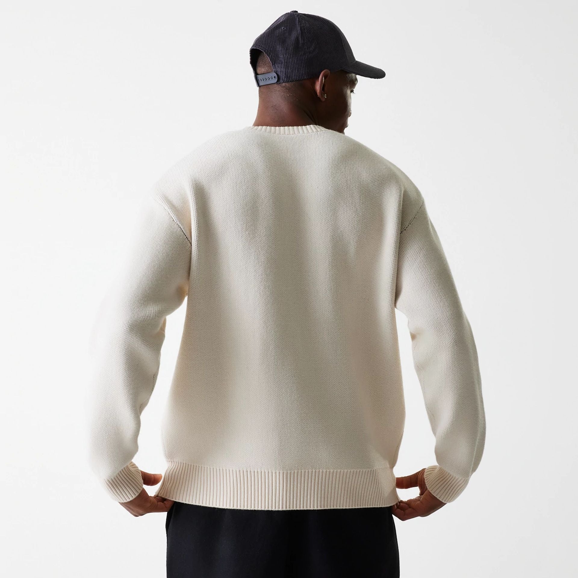 The Male model is wearing LA Lakers NBA Knit Light Beige Oversized Knit Sweater 3