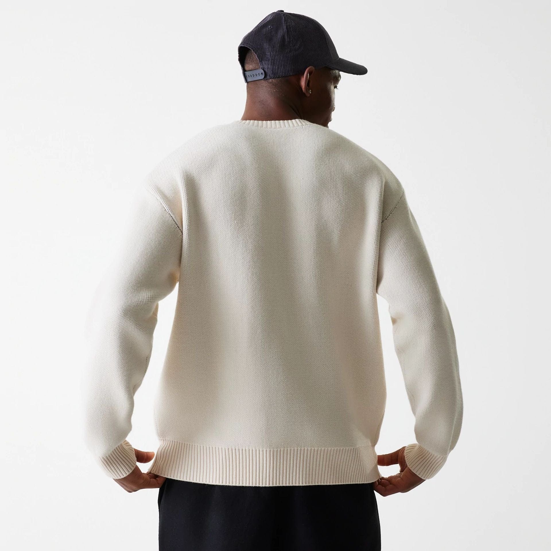 The Male model is wearing LA Lakers NBA Knit Light Beige Oversized Knit Sweater 3