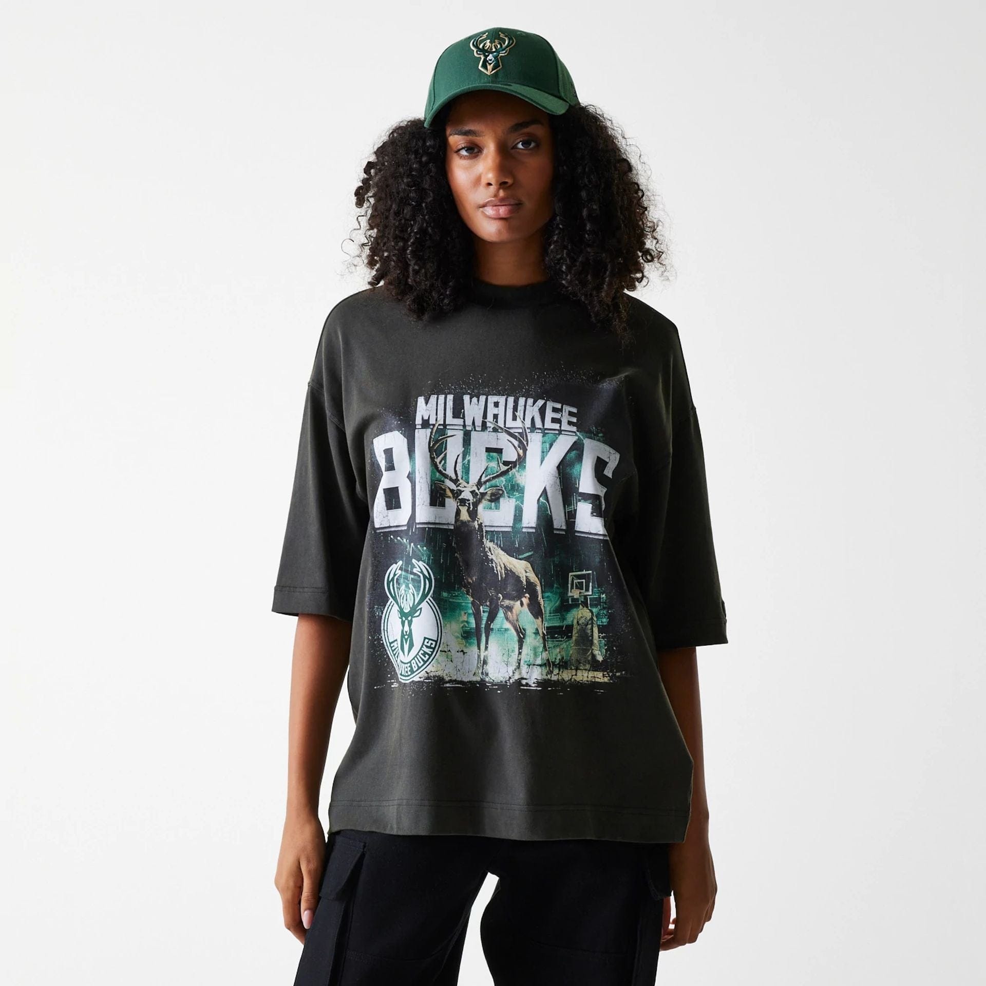 The Male model is wearing Milwaukee Bucks NBA Washed Graphic Grey T-Shirt 4